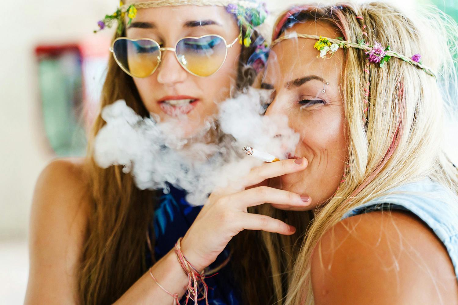 Two girls smoking and getting high together