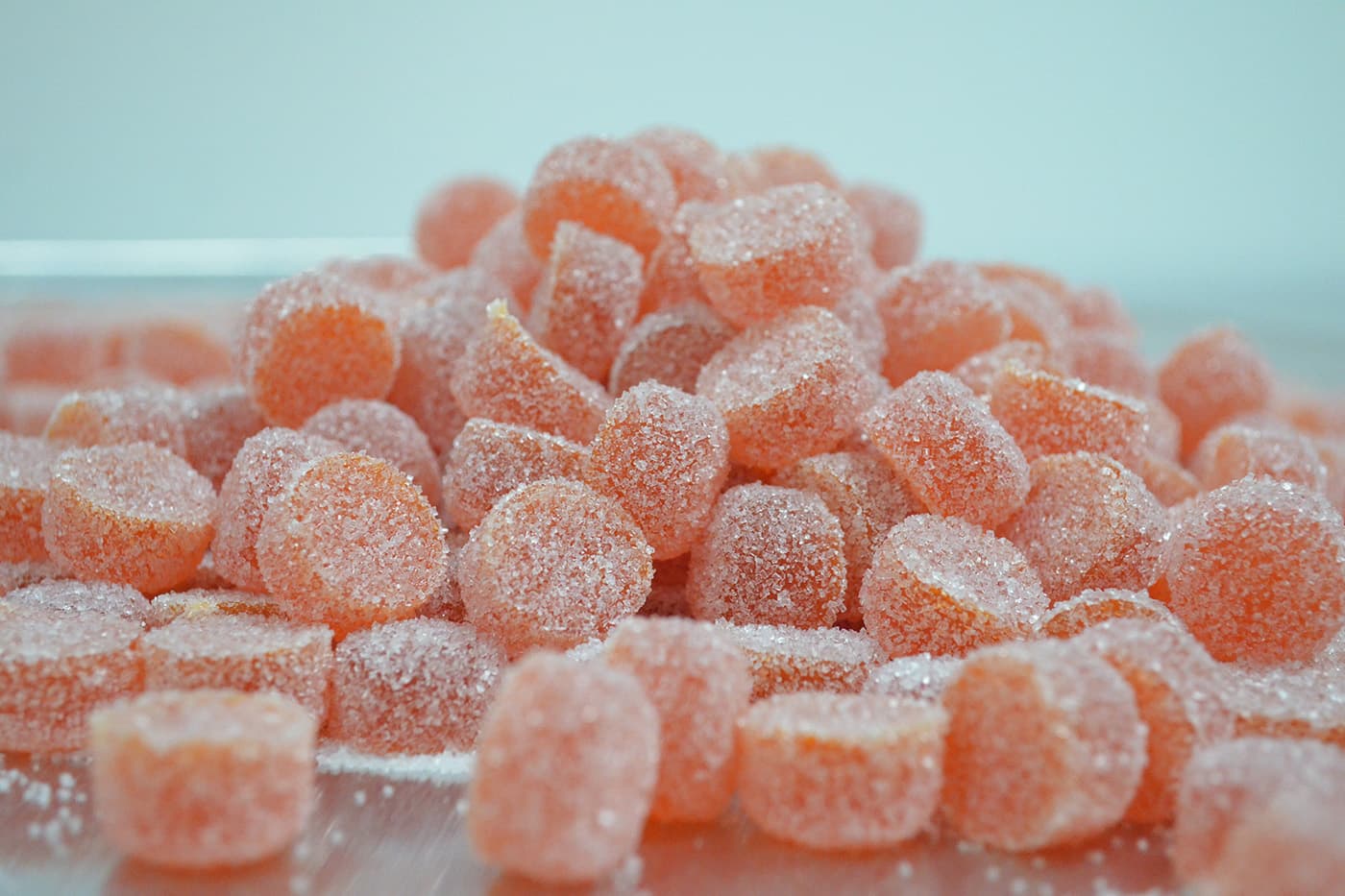 Delta 8 THC candies on blue background