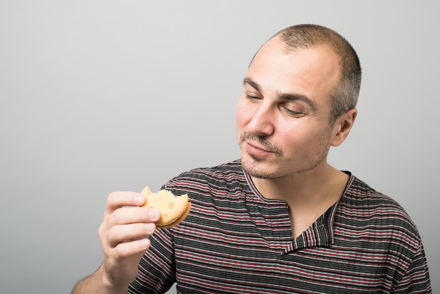 Man looking down at delta 8 THC cookie