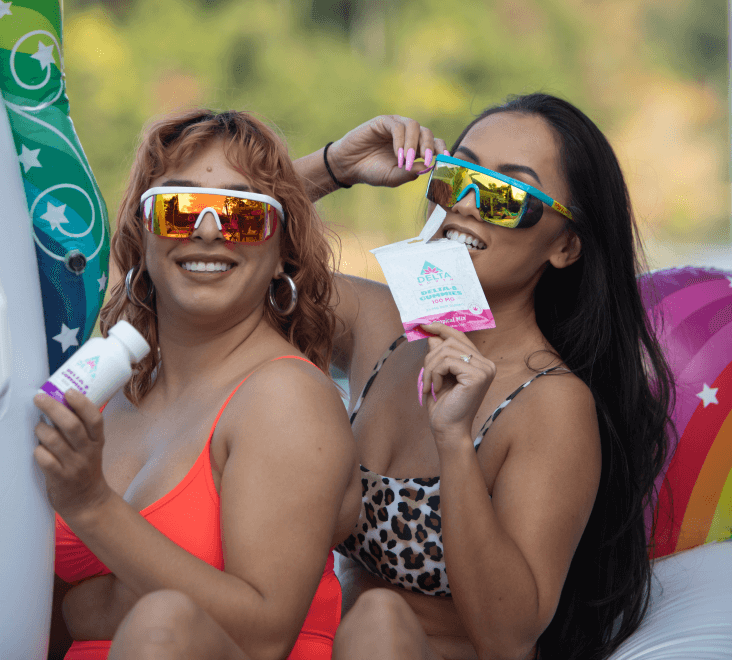 Two women smiling while using delta 8 edibles