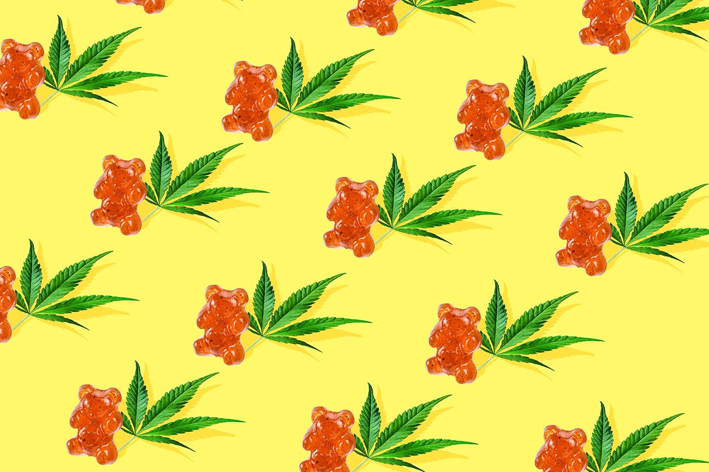 Delta 8 gummies on yellow background with leaves