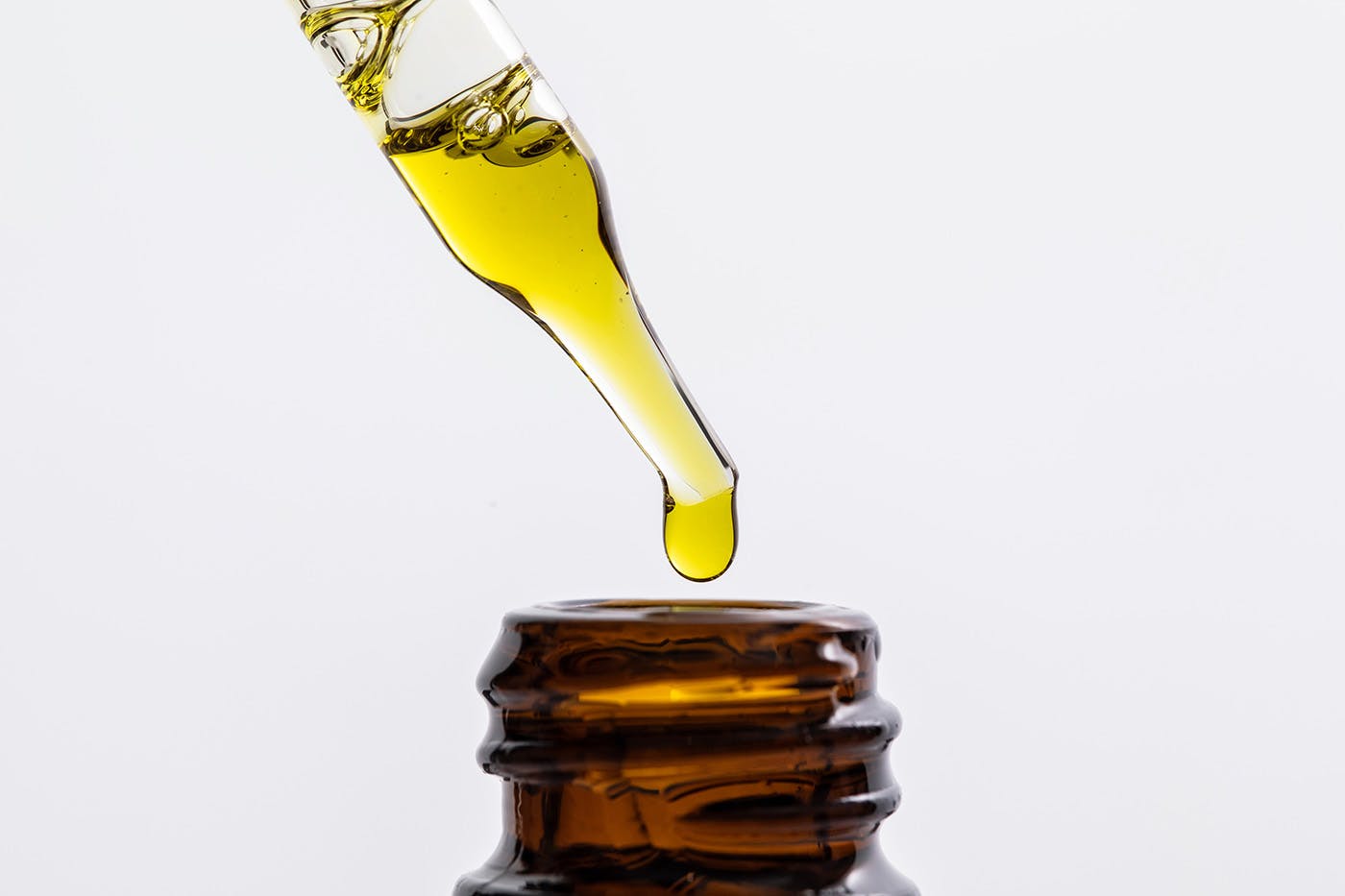 Delta 8 Oil tincture with dropper on white background