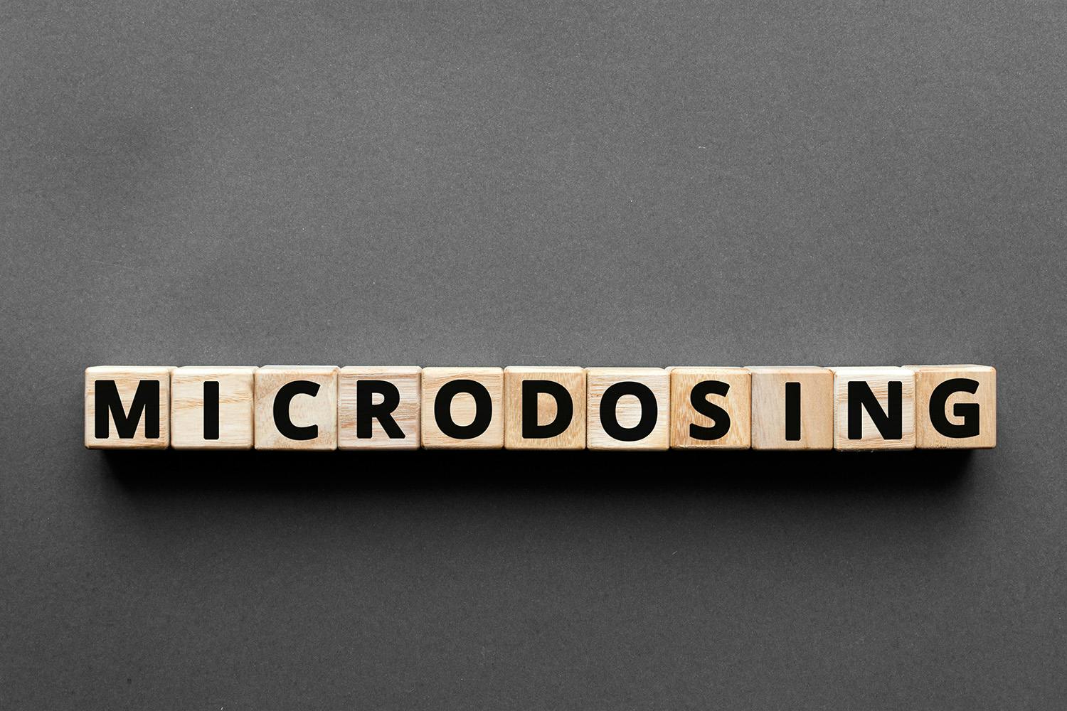 Microdosing letters written on wood blocks