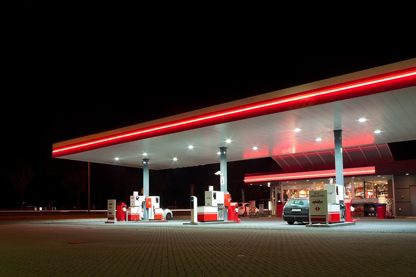 Gas station with lights on at night
